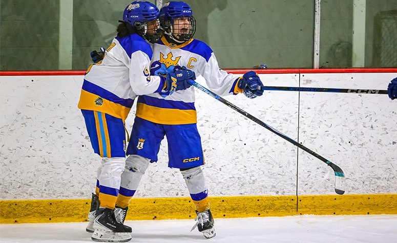 Lovell Academy's Aubryn Monter (right) and Chyna Taylor (left) celebrate a goal in the 2025 Mass. 16U state final. (Brian Kelly/NEHJ)